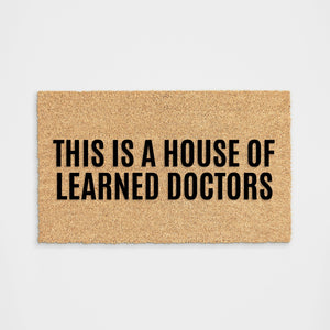 
            
                Load image into Gallery viewer, Learned Doctors Doormat
            
        